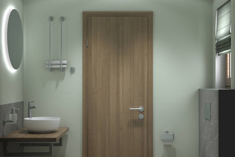 Pohľad na kúpeľňu s umývadlom, zrkadlom, dverami a toaletou