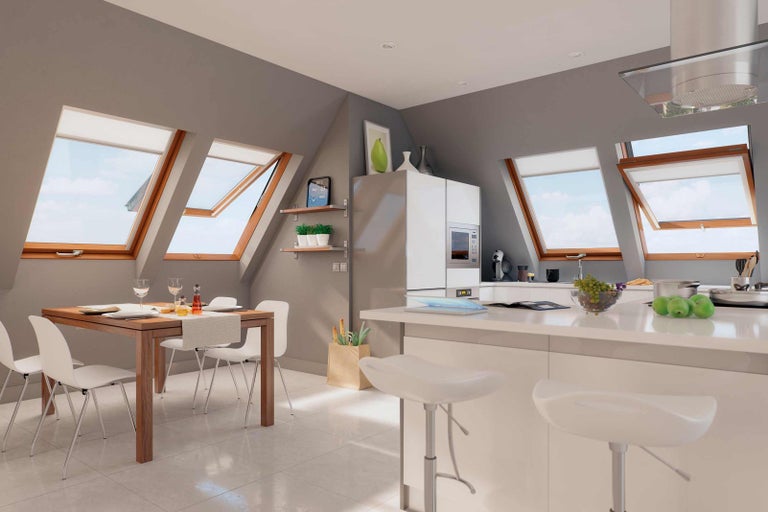 Svetlá podkrovná kuchyňa so strešnými oknami, jedálenským stolom a kuchynským ostrovom