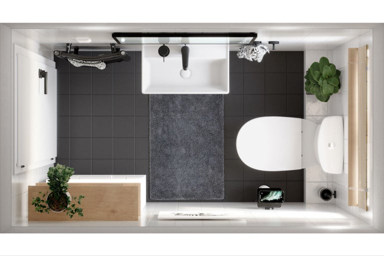 Pohľad zhora na kúpeľňu s umývadlom, toaletou, vaňou a tmavosivými dlaždicami.