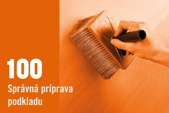 Ruka používa štetku na prípravu povrchu.