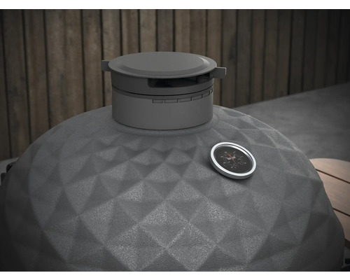 Detailný pohľad na gril kamado s ukazovateľom teploty a štruktúrovaným keramickým povrchom