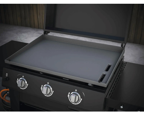 Gril s grilovacou doskou a ovládacími gombíkmi