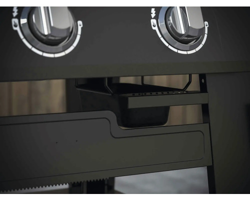 Detail grilu s otočnými gombíkmi a odkvapkávacou miskou