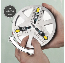 Nástroj na presné označenie vŕtaných otvorov s priemerom 45 až 130 milimetrov drží dve ruky.