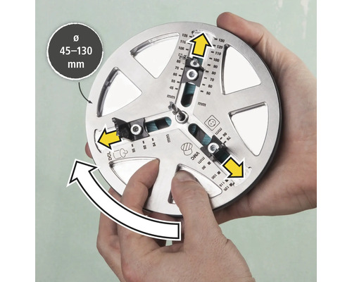 Nástroj na presné označenie vŕtaných otvorov s priemerom 45 až 130 milimetrov drží dve ruky.