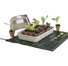 Sada na pestovanie s vyhrievacou podložkou, kvetináčmi a priehľadným vekom na pestovanie rastlín.