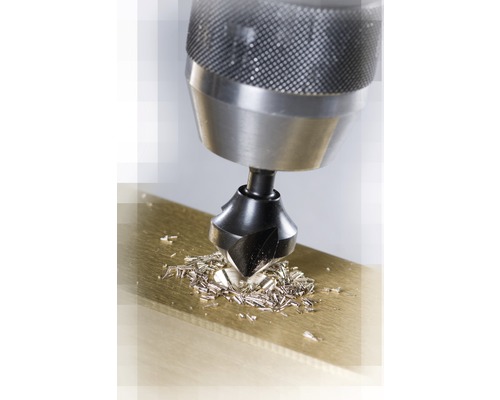 Zápustník pri zahlbovaní kusa kovu