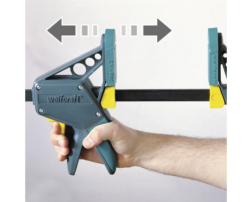 Wolfcraft zverák ovládaný jednou rukou so šípkami ukazujúcimi smer upnutia