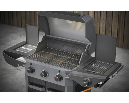Plynový gril s grilovacími roštami, ohrievacím roštom a bočnými policami