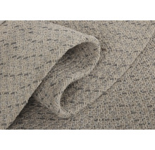 Detail svetlého koberca s tkanou štruktúrou