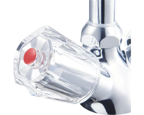 Vodovodný kohútik s priehľadnou rukoväťou a červeným gombíkom