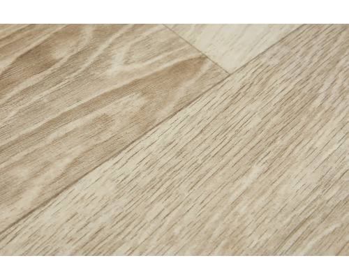 Detail laminátovej podlahy s dreveným vzhľadom