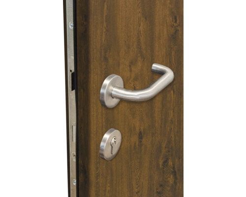 Detail dverí s kľučkou a zámkom