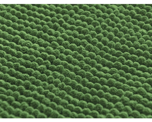 Detail zeleného ženilkového koberca