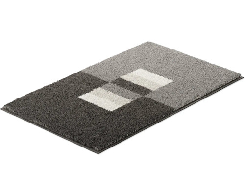 Obdĺžnikový koberec s geometrickým vzorom v rôznych odtieňoch šedej