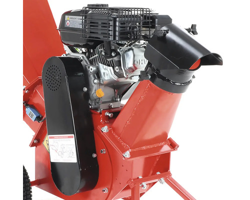 Detailný záber červeného drviča dreva s motorom