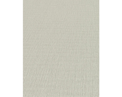 Detailný pohľad na béžovú štruktúrovanú tapetu.