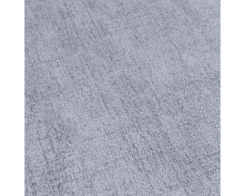 Detail svetlej, štruktúrovanej textílie.