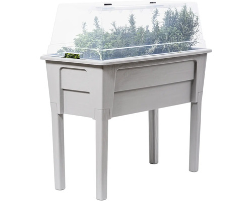 Vyvýšený záhon s bylinkami a priehľadným krytom do záhrady