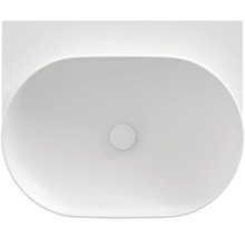 Pohľad zhora na oválne umývadlo na dosku z keramiky.