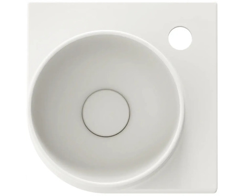 Pohľad zhora na umývadlo na dosku zo sanitárnej keramiky s otvorom pre kohútik