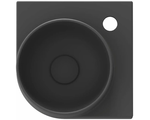 Pohľad zhora na čierne umývadlo na dosku s otvorom pre vodovodnú batériu