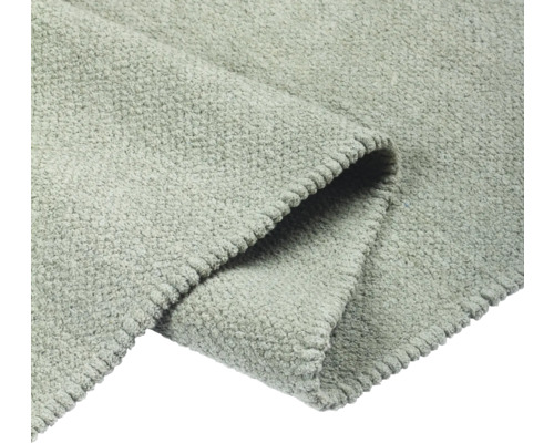 Detailný pohľad na sivý koberec s textúrou