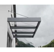 Moderná sklenená strieška s antracitovým hliníkovým rámom, namontovaná na vonkajšej stene pomocou tiahla.