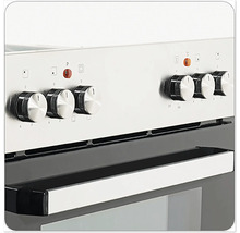 Detailný záber sporáka s otočnými gombíkmi na reguláciu teploty