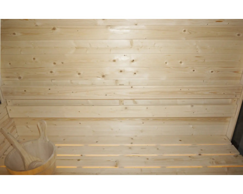 Drevená sauna s dreveným vedrom a drevenou lyžicou