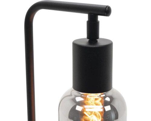 Stolná lampa so skleneným tienidlom.