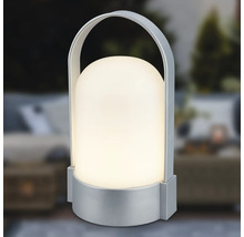 Prenosná stolná LED lampa so strieborným podstavcom a držadlom, tienidlo v tvare kupoly, teplé biele svetlo.