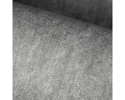 Detailný záber štruktúrovanej vliesovej tapety s jemnou povrchovou textúrou.