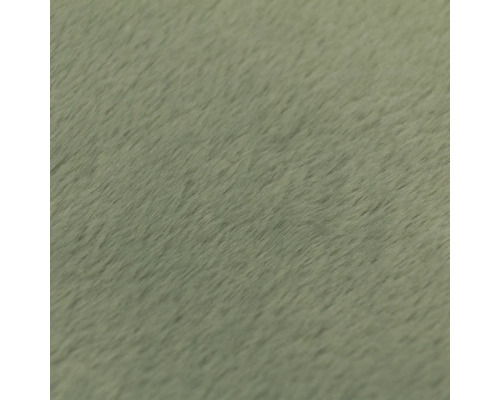 Detailný záber na mäkký, plyšový povrch látky alebo štruktúru koberca.