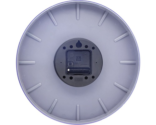 Zadná strana okrúhlych nástenných hodín so strojčekom