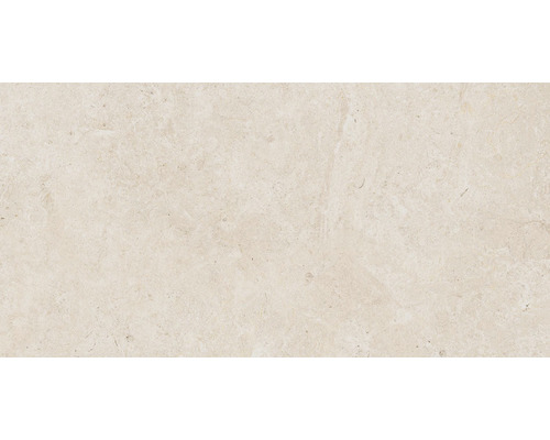 Detail svetlej dlaždice z prírodného kameňa s matným povrchom