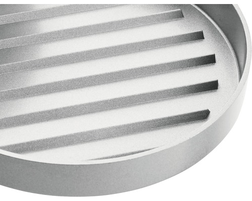 Okrúhly kovový grilovací rošt s ryhovaným povrchom