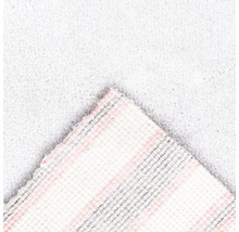 Detail svetlého koberca s textilným podkladom