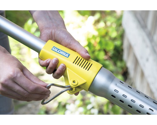 Logo Gloria na spaľovači buriny s rukou na zapaľovacom mechanizme