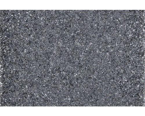 Detailný záber tmavej pracovnej dosky s bodkovaným povrchom