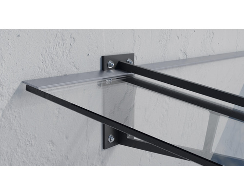 Strieška s oceľovými nosníkmi a sklenenou doskou namontovaná na stene