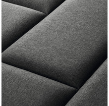 Detail šedého prešívaného nástenného panelu