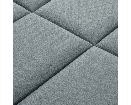 Detail čalúneného stenového panelu so štvorcovým vzorom