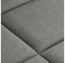 Detail čalúneného nábytku s látkovým poťahom a prešívaným vzorom