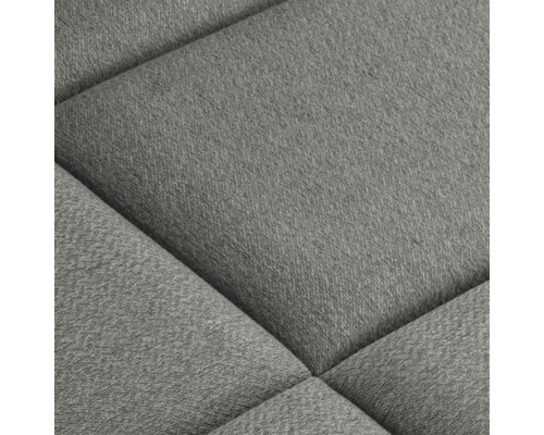 Detail čalúneného nábytku s látkovým poťahom a prešívaným vzorom