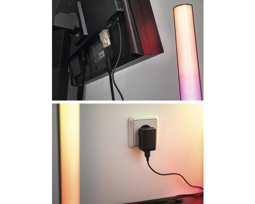 Detailný záber monitora s káblovými prípojkami a stojacej lampy a tiež napájacieho zdroja v zásuvke