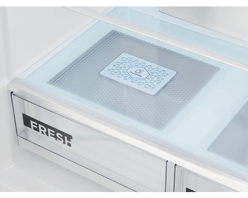 Vnútro chladničky so zásuvkou na čerstvé potraviny a symbolom vlhkosti