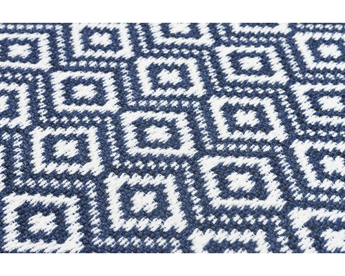 Detail koberca s geometrickým vzorom