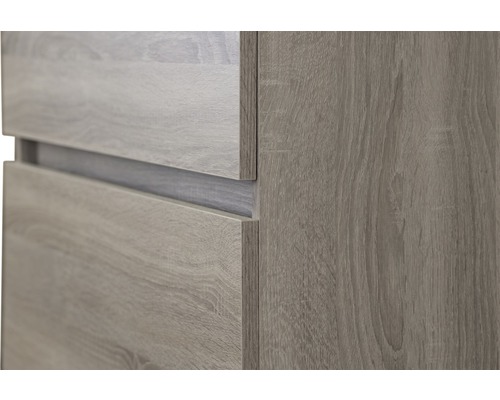 Detailný pohľad na nábytok s drevenou štruktúrou a zásuvkami