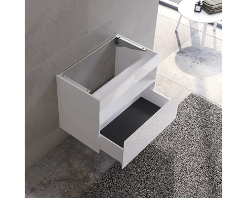 Biely umývadlový stolík na montáž na stenu s otvorenou zásuvkou a policou